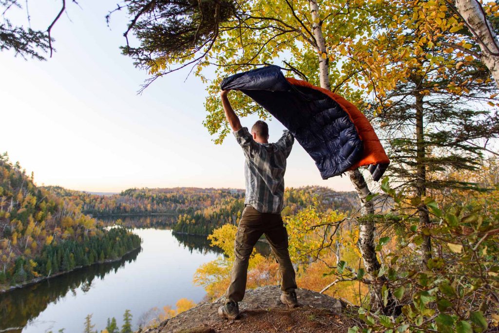 Standing over a lake near Finland, Minnesota, with my Enlightened Equipment quilt during a beautiful fall evening on the Superior Hiking Trail.